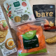 low sodium snacks from left to right, wheat crackers, pumpkin seeds, carrot chips, bare apple chips, banana